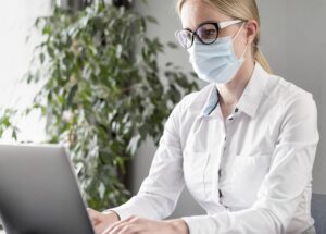 young woman doing her classes while wearing face mask